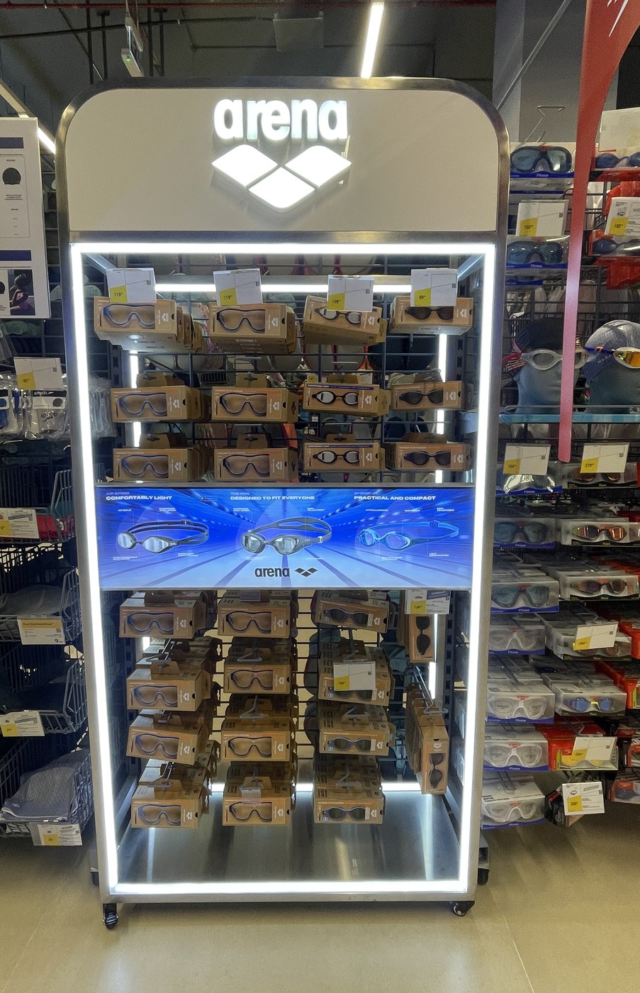 Illuminated Arena goggles display fixture in a sports retailer